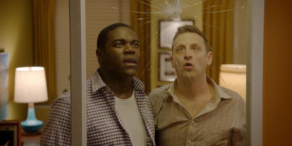Sam Richardson and Tim Robinson looking at a broken window in Detroiters