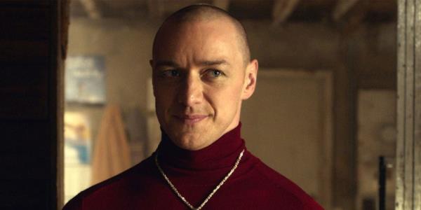 Patricia (James McAvoy) smiling and wearing a red turtleneck shirt in Split