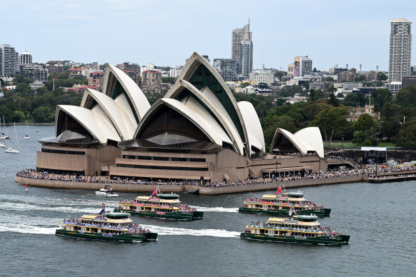 Ferries race past the Opera House in the annual Ferrython. 